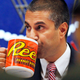 Ajit Pai, pictured here at the 2017 meeting where the GOP-controlled FCC voted to gut net neutrality rules.